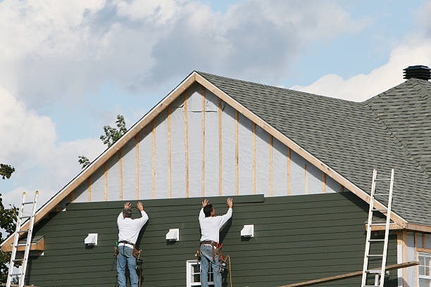 Professional Siding Repair technician working in Ellicott City, MD